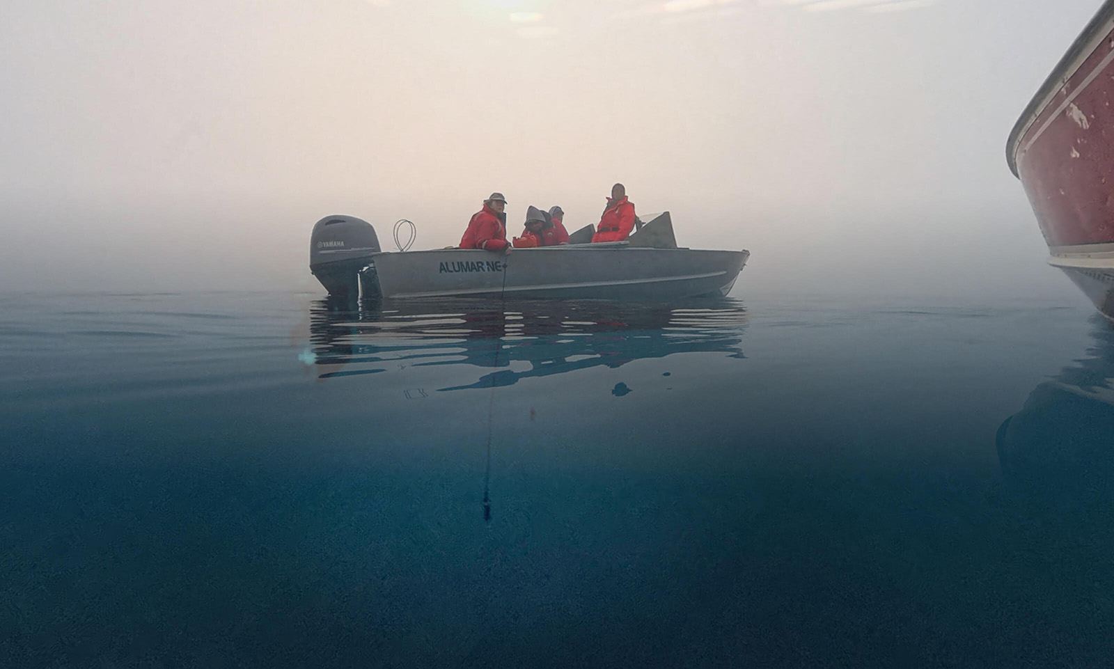 The research team recovers and deploys hydrophones used to document the underwater soundscape around Ulukhaktok.
